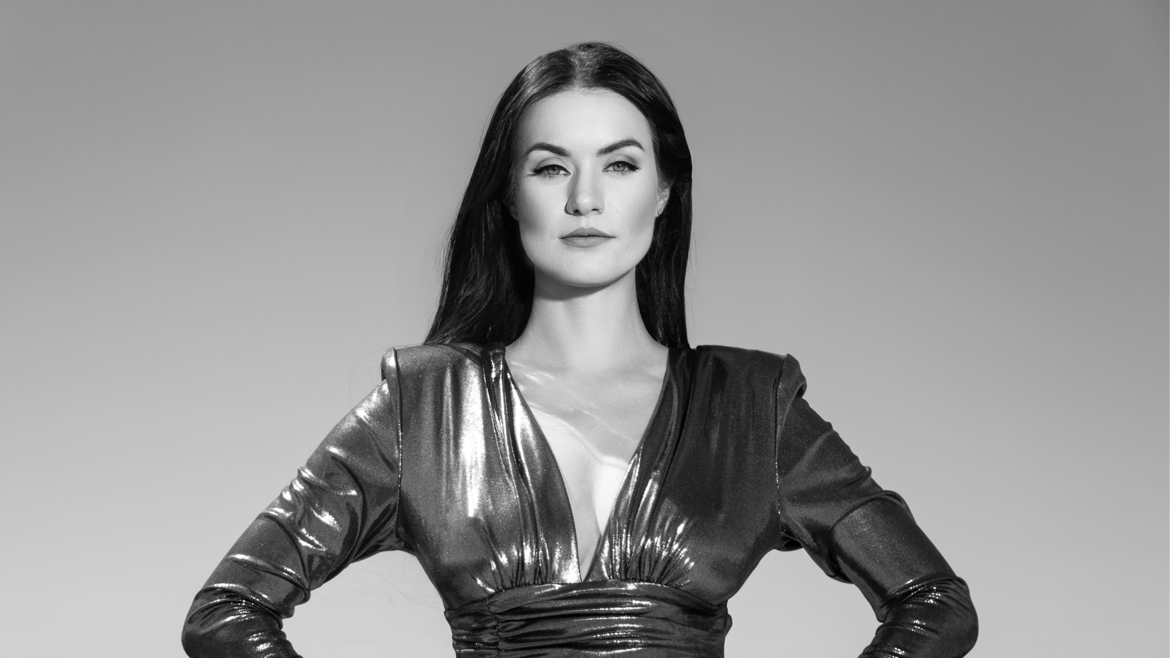 Breaking into male-dominated industries by Elena Biedert Elena Biedert standing in a power pose and looking into camera